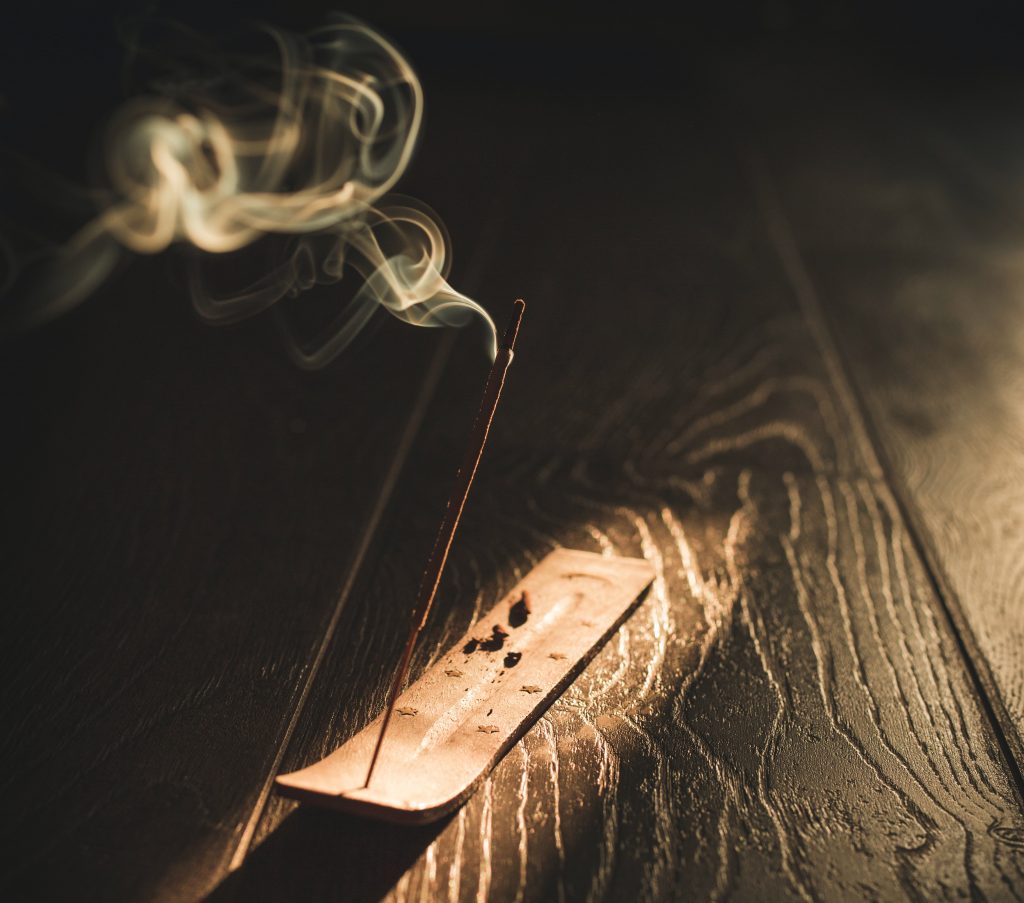 An image showing burning incense: Step 1 of 5 basic steps for meditation: prepare