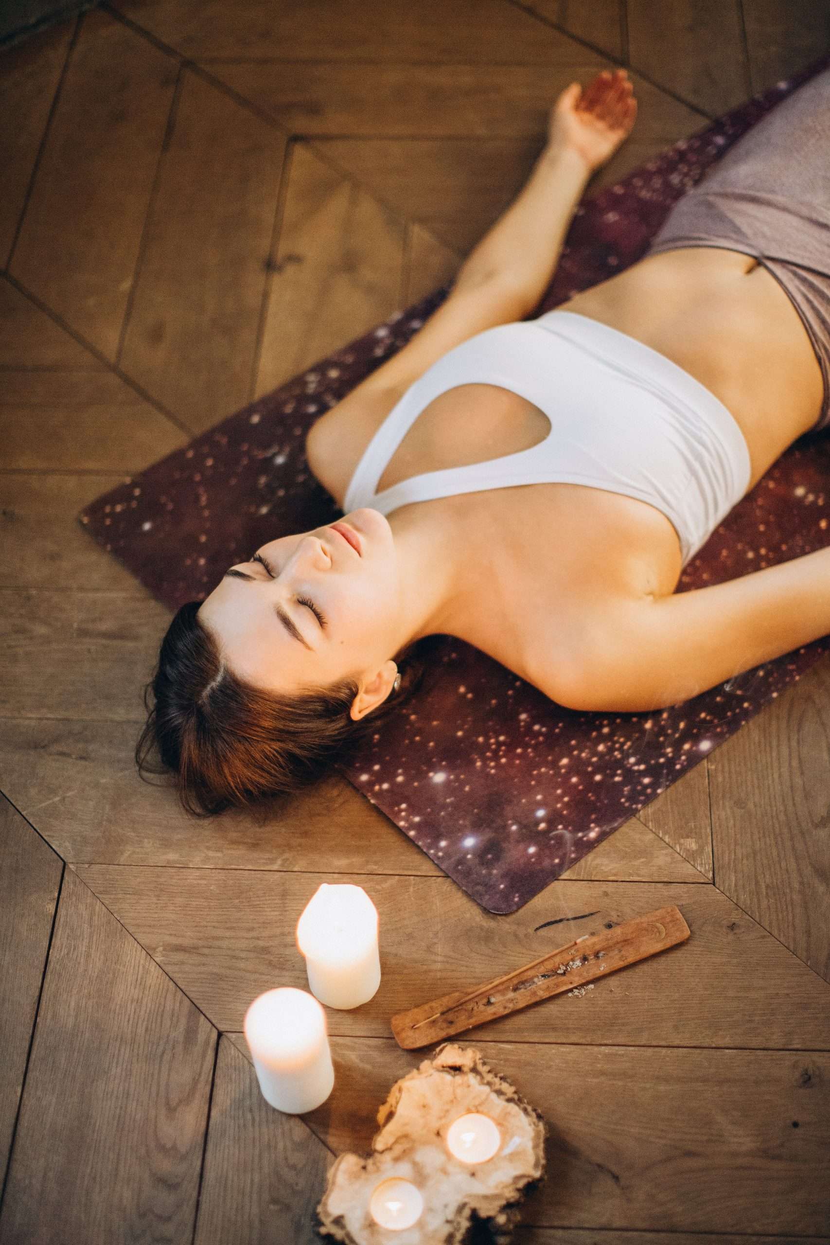 Girl in the yoga pose Savasana - final relaxation. An important part of every yoga practice and enough time should be planned in for savasana, when sequencing a yoga class.