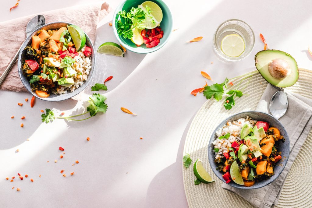 Image depicting bowls of food with whole plant based ingredients. Eat more plant-based food to fight depression.