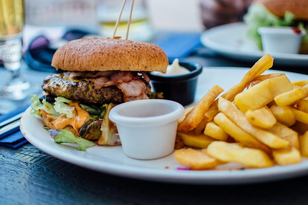 Image showing burger and fries, as an example to avoid saturated foods, as they are pro-inflammatory.