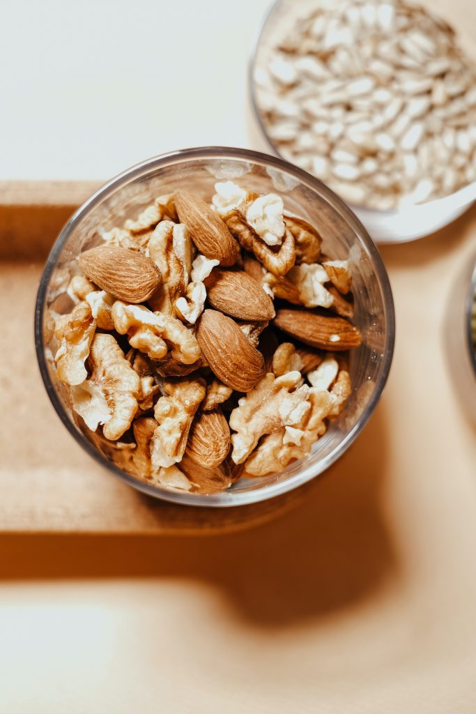 Image of nuts in a glass. Walnuts are especially nutritious, great sources of omega 3 and can a good food to fight depression.