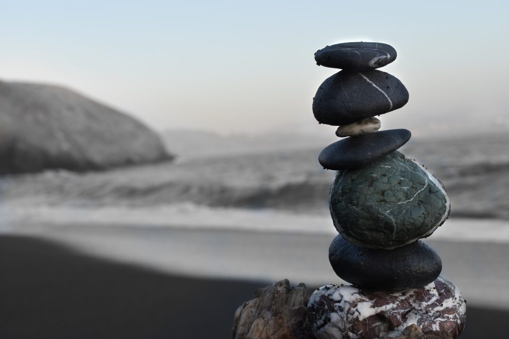 Image showing a stone pile, balanced, with the ocean in the background.