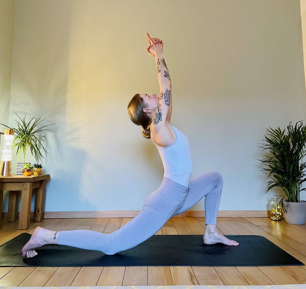 Image showing a girl practicing another variation of Anjaneyasana - low lunge. Low lunge opens the front thighs and hip flexors and can help reduce lower back pain.