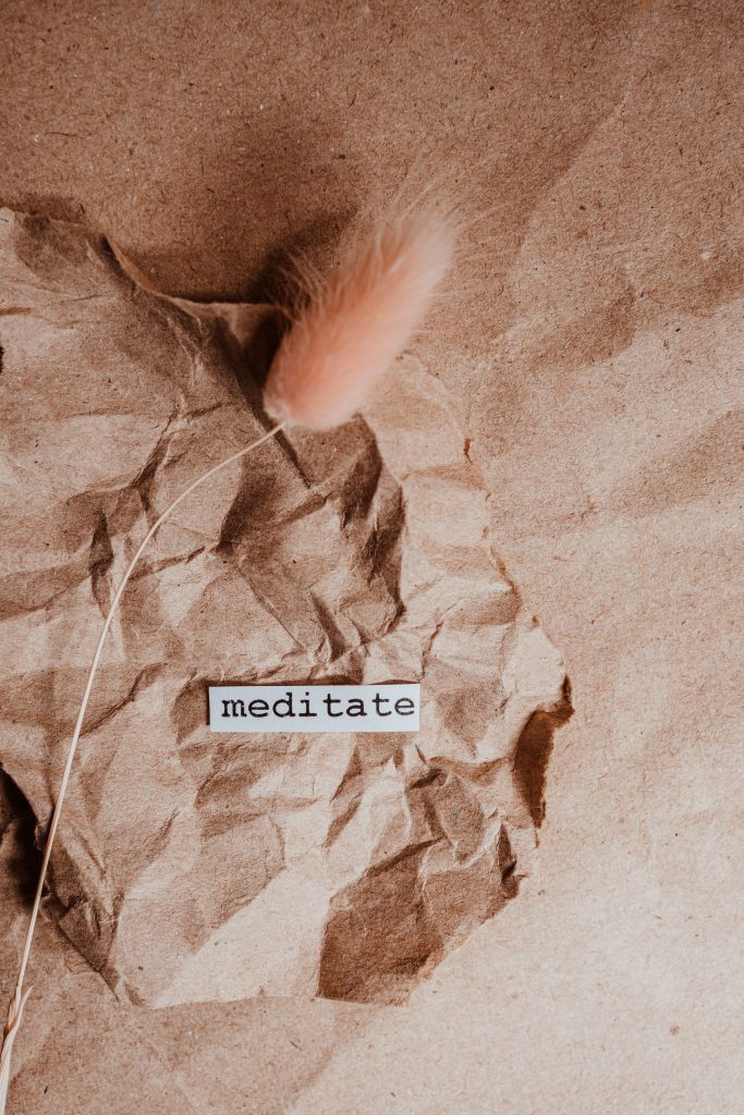 Two images showing dried flowers and reading the words "meditate" and "mindfulness". 